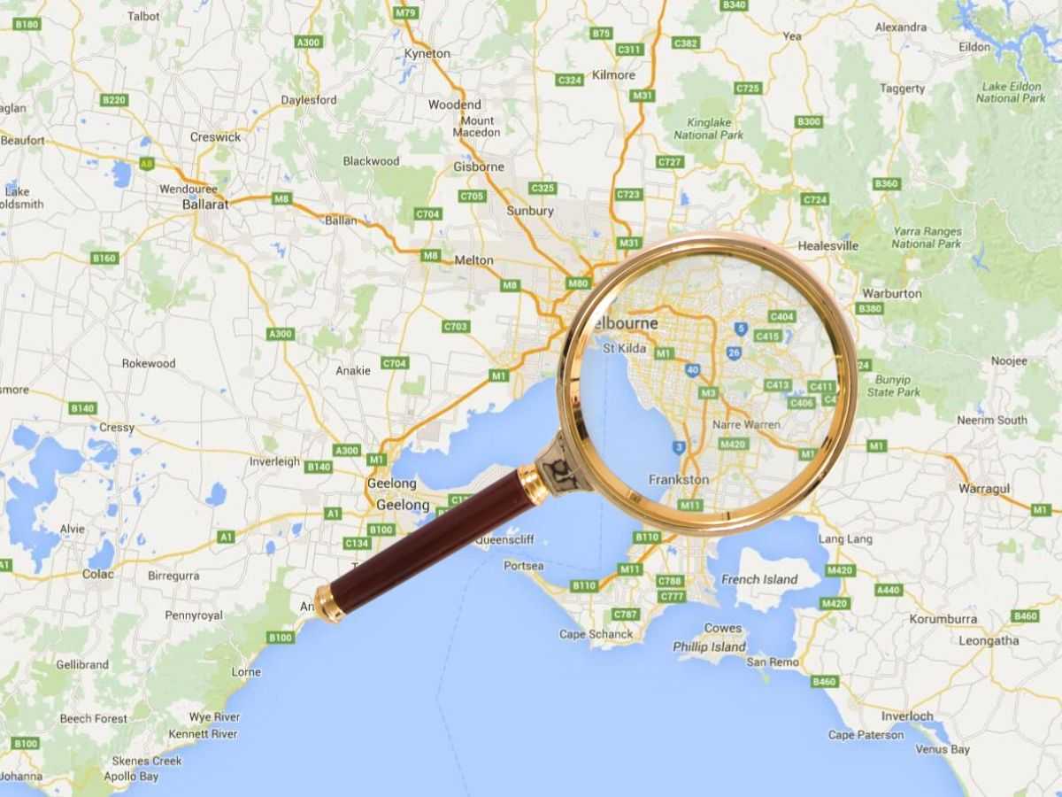 A map with a magnifying glass laying across it